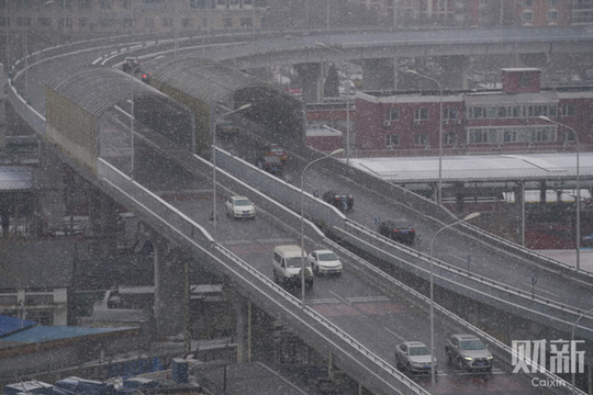 北京降雪节后“开工” 雪中京城银装素裹(27) 第27页